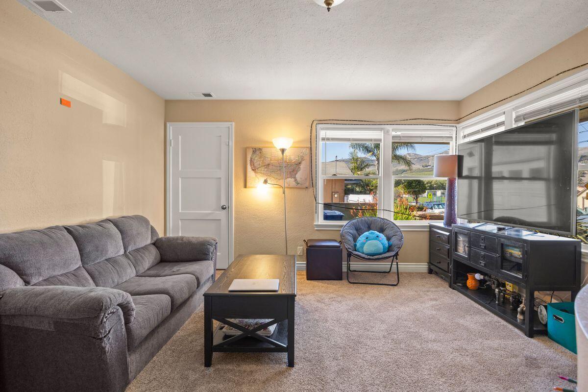 354 West Prospect Street Ventura, CA 93001 - Photo 5 of 41 a living room with furniture a rug and a window