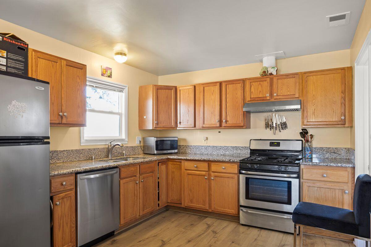 354 West Prospect Street Ventura, CA 93001 - Photo 10 of 41 a kitchen with a sink stove and refrigerator