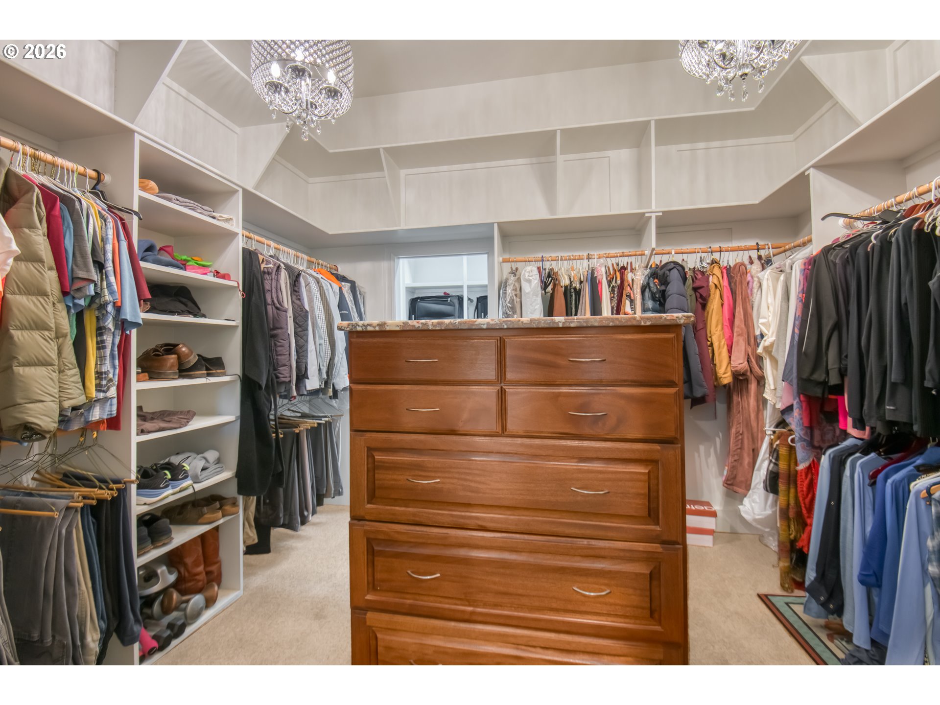 56888 Northwest Strassel Road Forest Grove, OR 97116 - Photo 21 of 48 a view of walk in closet with clothes and shoes