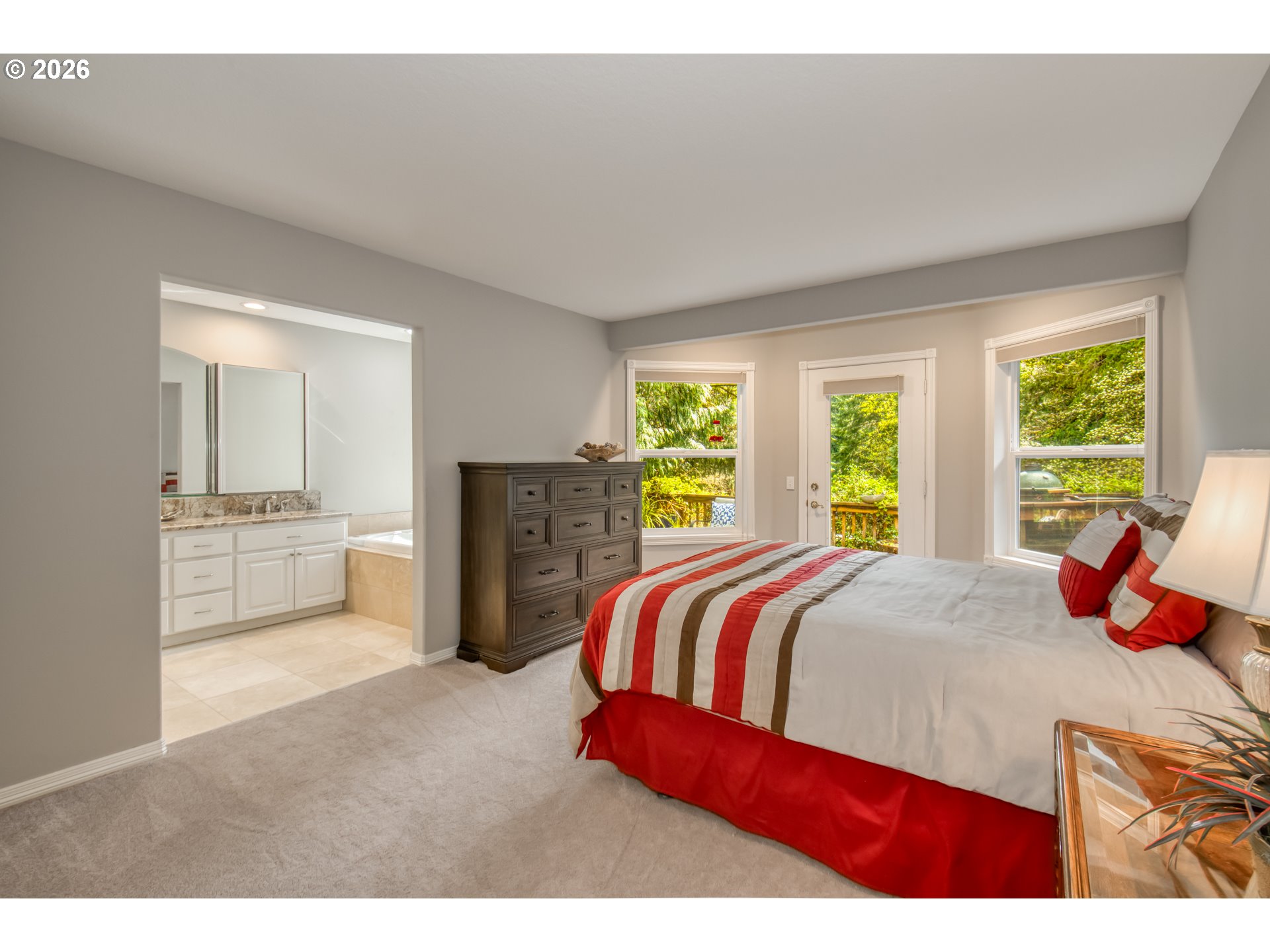 56888 Northwest Strassel Road Forest Grove, OR 97116 - Photo 24 of 48 a bedroom with a large bed and a large window