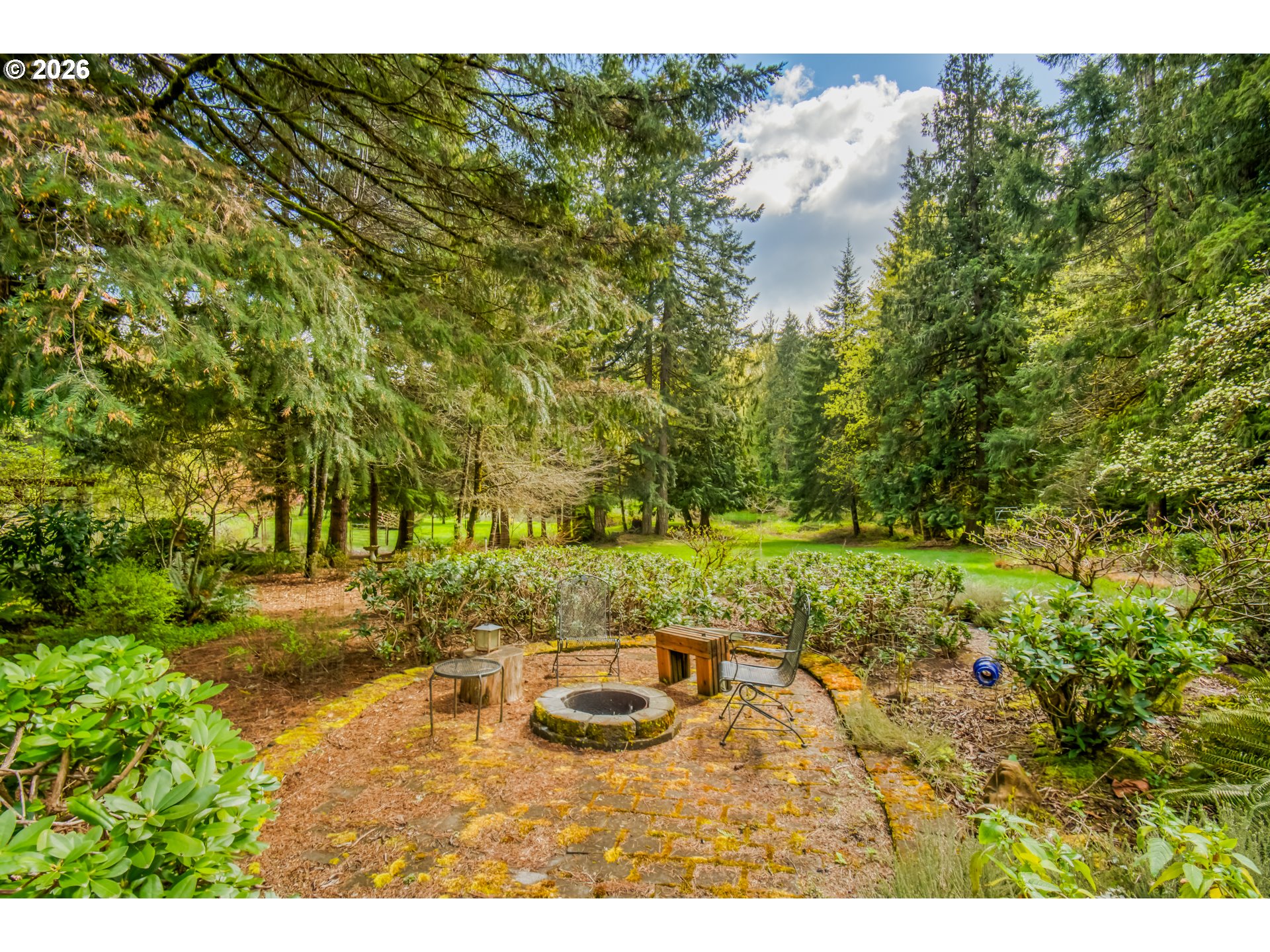 56888 Northwest Strassel Road Forest Grove, OR 97116 - Photo 32 of 48 a view of a backyard with table and chairs