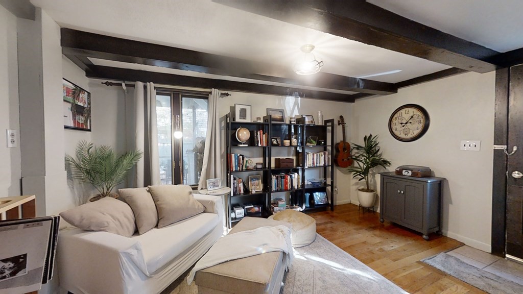 5 Pleasant Street Amesbury, MA 01913 - Photo 11 of 36 a living room with furniture and a clock