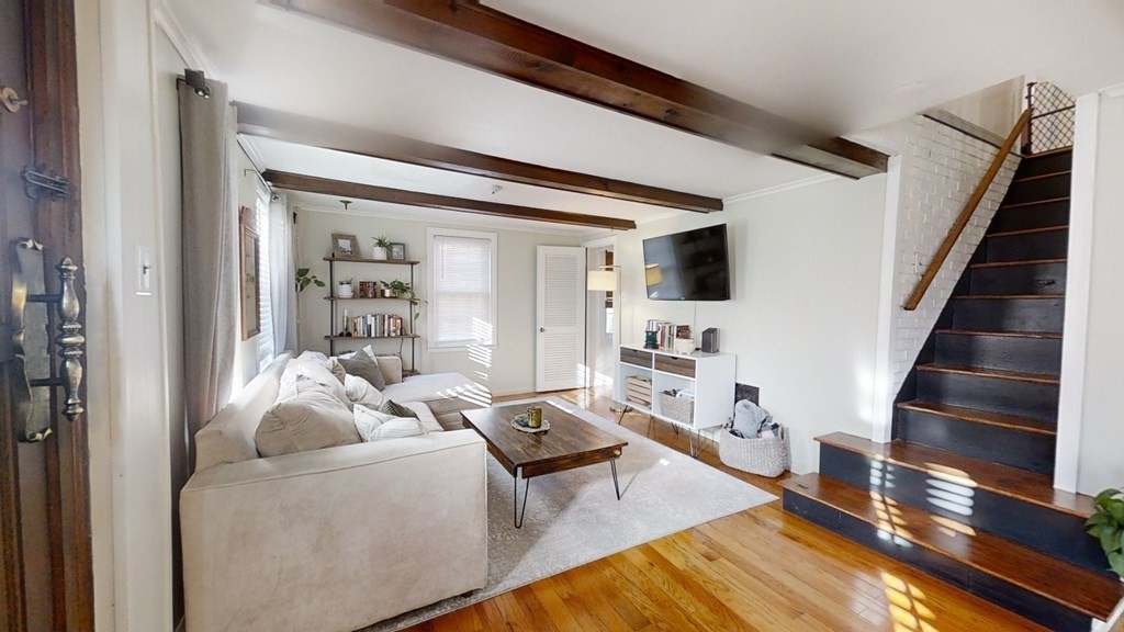 5 Pleasant Street Amesbury, MA 01913 - Photo 16 of 36 a living room with furniture and a flat screen tv