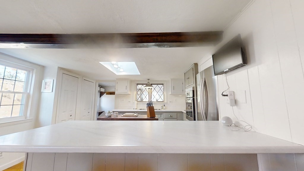 5 Pleasant Street Amesbury, MA 01913 - Photo 18 of 36 a large white kitchen with a large window