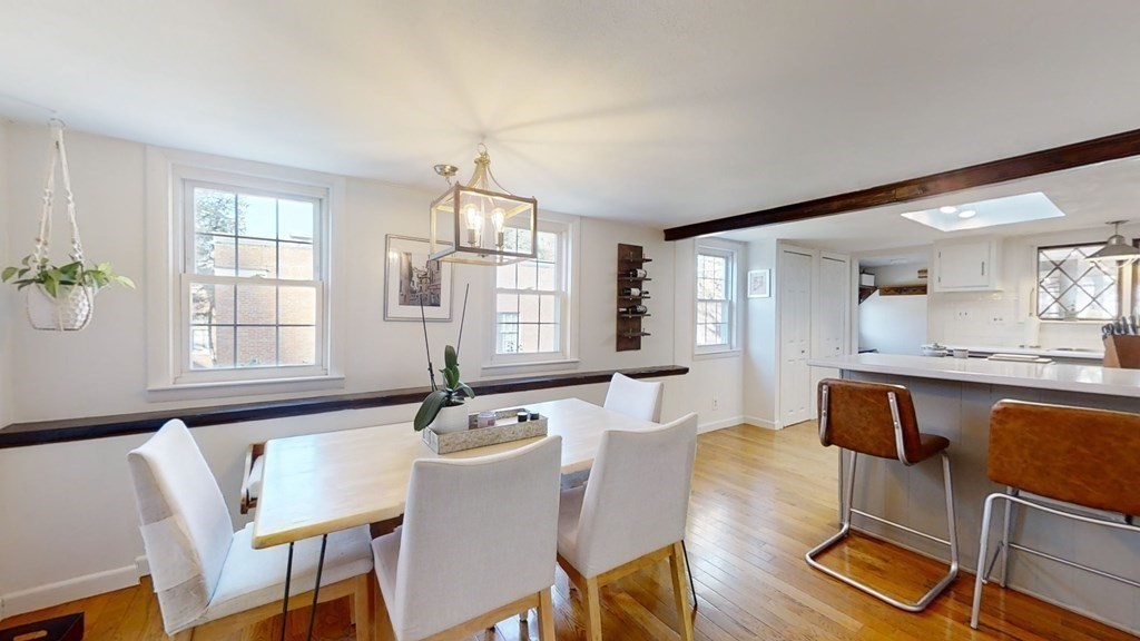 5 Pleasant Street Amesbury, MA 01913 - Photo 22 of 36 a view of a dining room with furniture window and wooden floor