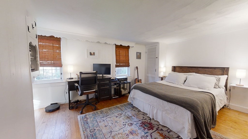 5 Pleasant Street Amesbury, MA 01913 - Photo 26 of 36 a bedroom with a workspace