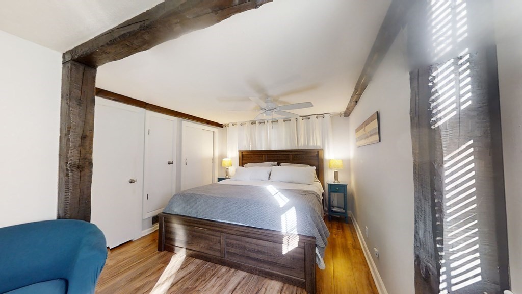 5 Pleasant Street Amesbury, MA 01913 - Photo 28 of 36 a bed room with a bed and a couch