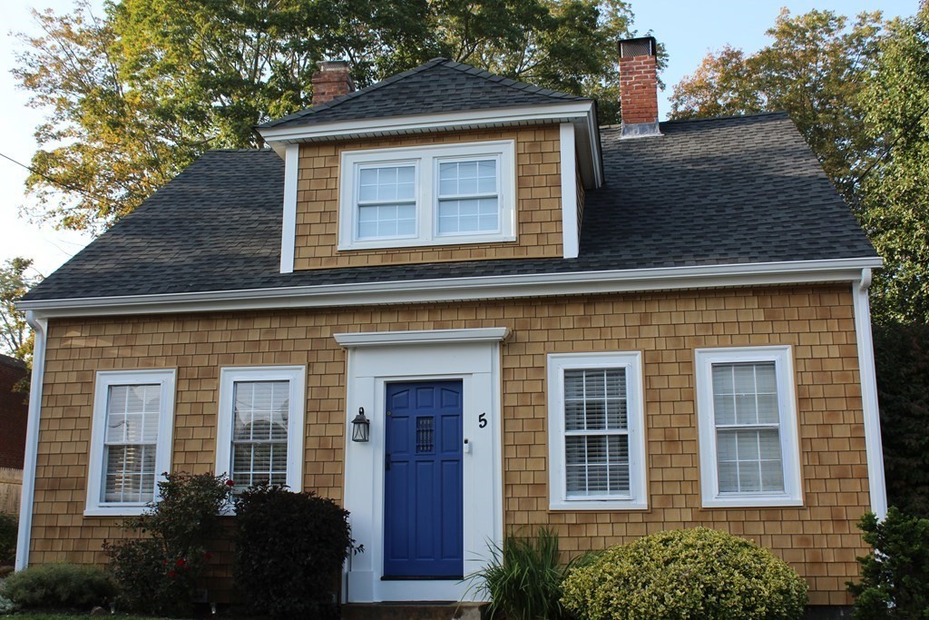 5 Pleasant Street Amesbury, MA 01913 - Photo 3 of 36 a front view of a house with a yard