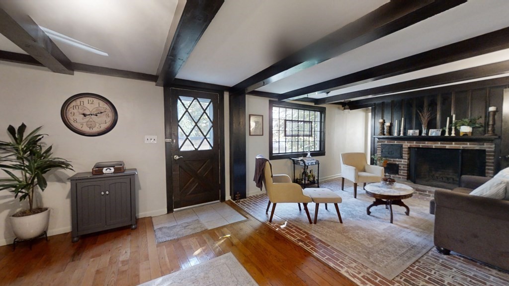 5 Pleasant Street Amesbury, MA 01913 - Photo 7 of 36 a living room with furniture a window and a clock