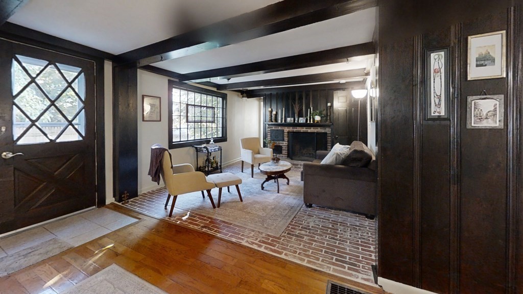 5 Pleasant Street Amesbury, MA 01913 - Photo 8 of 36 a living room with furniture and a fireplace