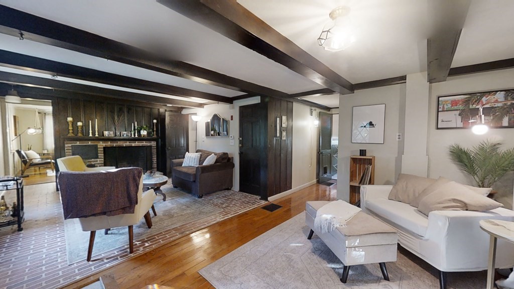5 Pleasant Street Amesbury, MA 01913 - Photo 9 of 36 a living room with furniture and a wooden floor