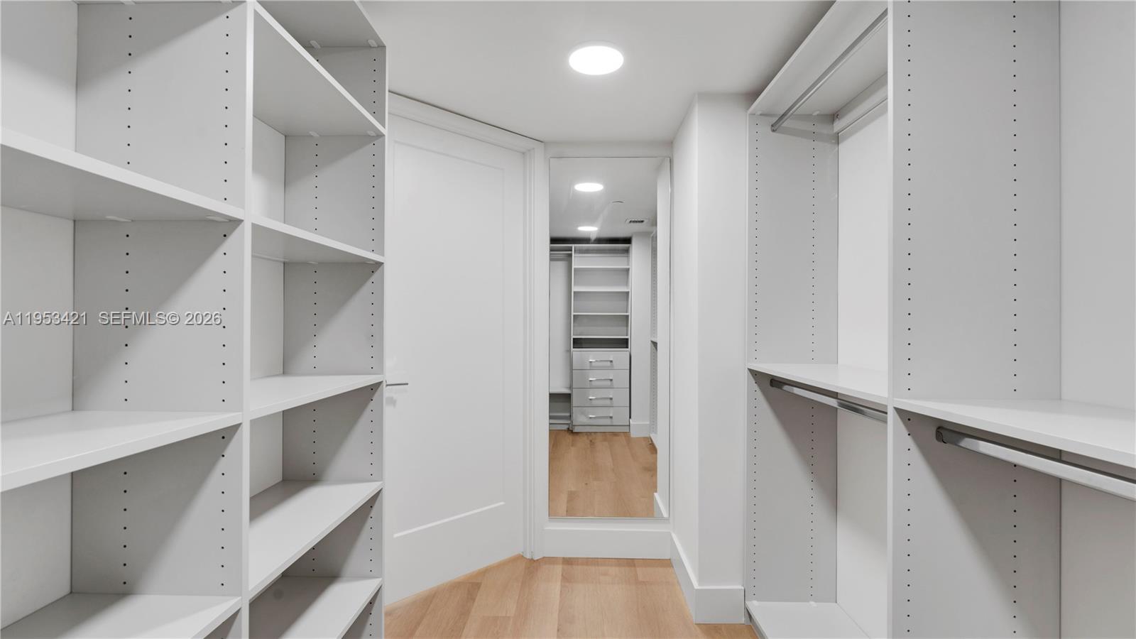 555 Northeast 34th Street, Unit 705 Miami, FL 33137 - Photo 20 of 28 a view of walk in closet with empty racks