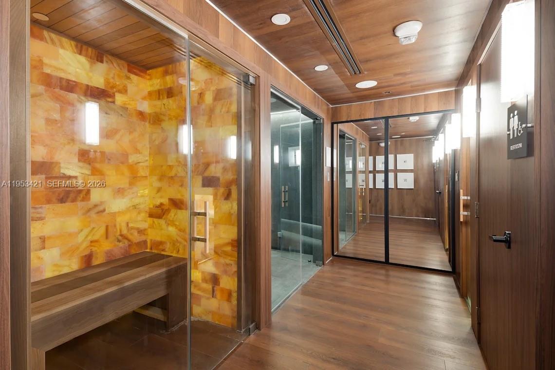 555 Northeast 34th Street, Unit 705 Miami, FL 33137 - Photo 28 of 28 a bathroom with a glass shower door and a shower