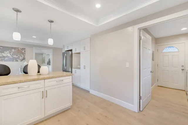 a bed room with a bed and a ceiling fan