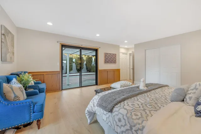 a spacious bathroom with a double vanity sink and a mirror