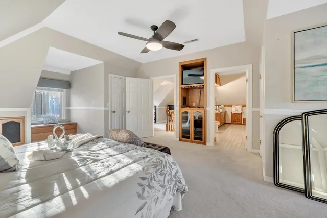 a front view of a house with a yard and balcony