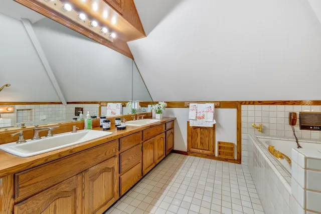 an aerial view of residential houses with outdoor space and street view