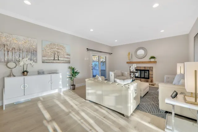 a spacious bedroom with a bed and a large window