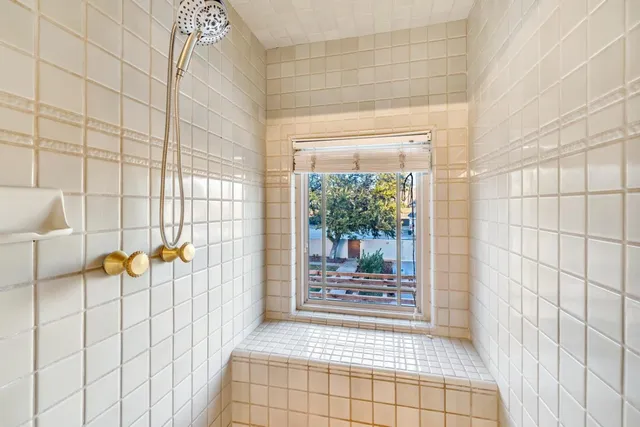 a view of a house with a swimming pool and sitting area