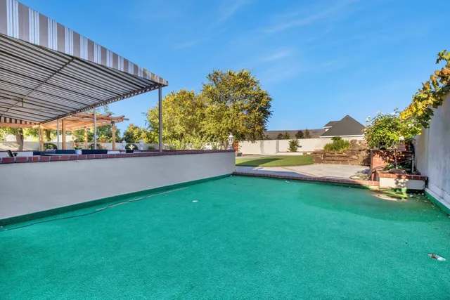 a view of an empty room with a fireplace