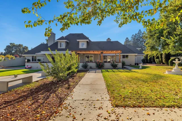 a view of a patio with table and chairs