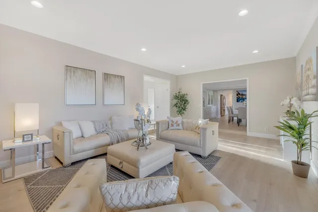 a bedroom with a large bed and a lamp with window