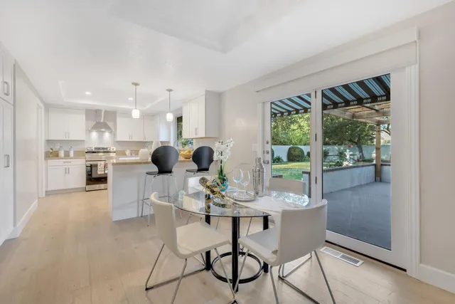 a bathroom with a double vanity sink mirror and toilet
