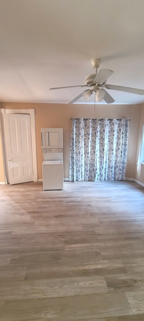 1332 West 18th Street, Unit 2F Chicago, IL 60608 - Photo 3 of 11 a view of empty room with wooden floor and fan