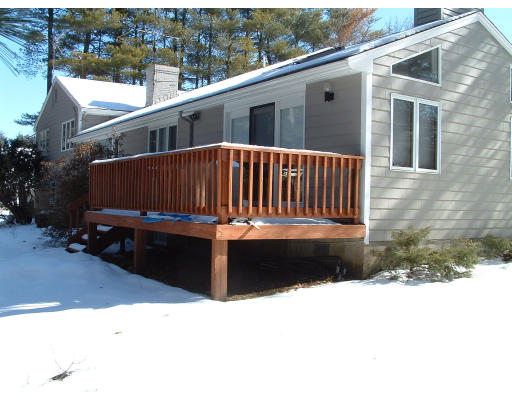 36 Red Barn Road Wayland, MA 01778 - Photo 3 of 12 a view of a house with a wooden fence
