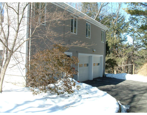 36 Red Barn Road Wayland, MA 01778 - Photo 4 of 12 a front view of a house with a yard