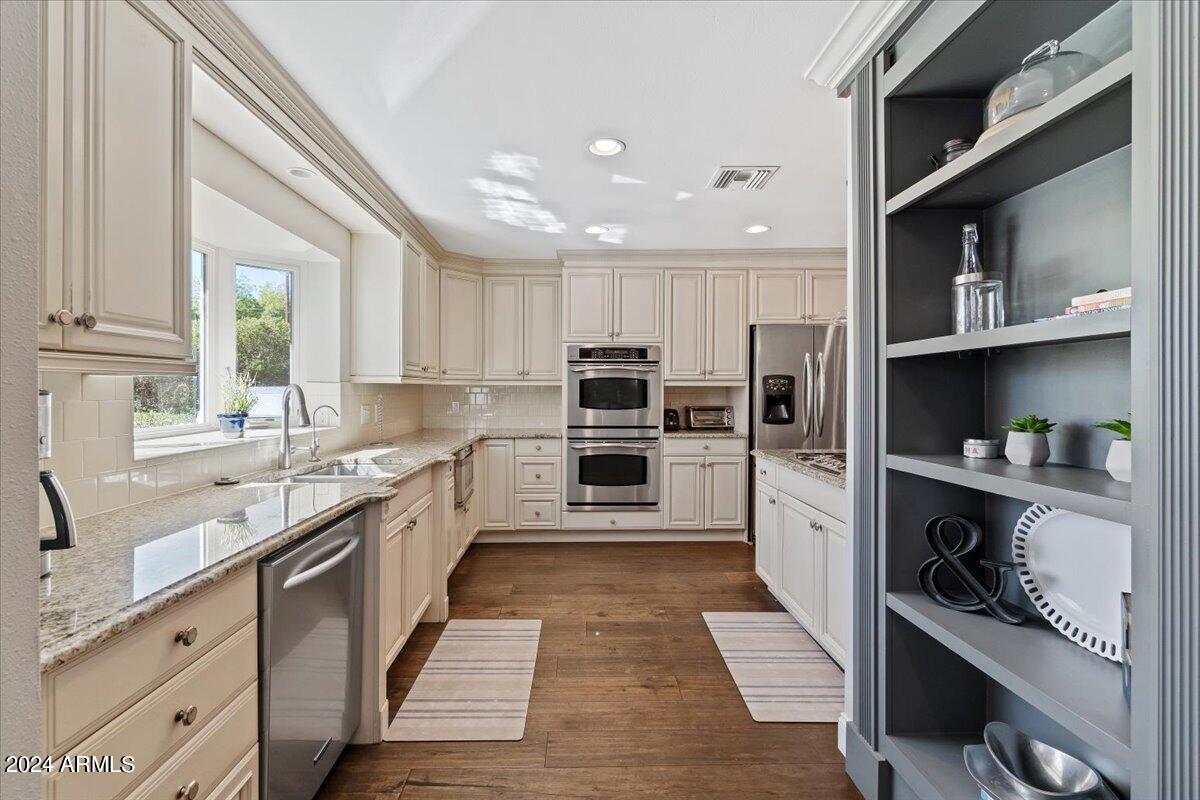 3841 East Elm Street Phoenix, AZ 85018 - Photo 24 of 72 a large kitchen with stainless steel appliances lots of counter space and a sink
