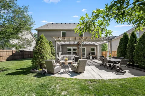 a view of a backyard with large trees
