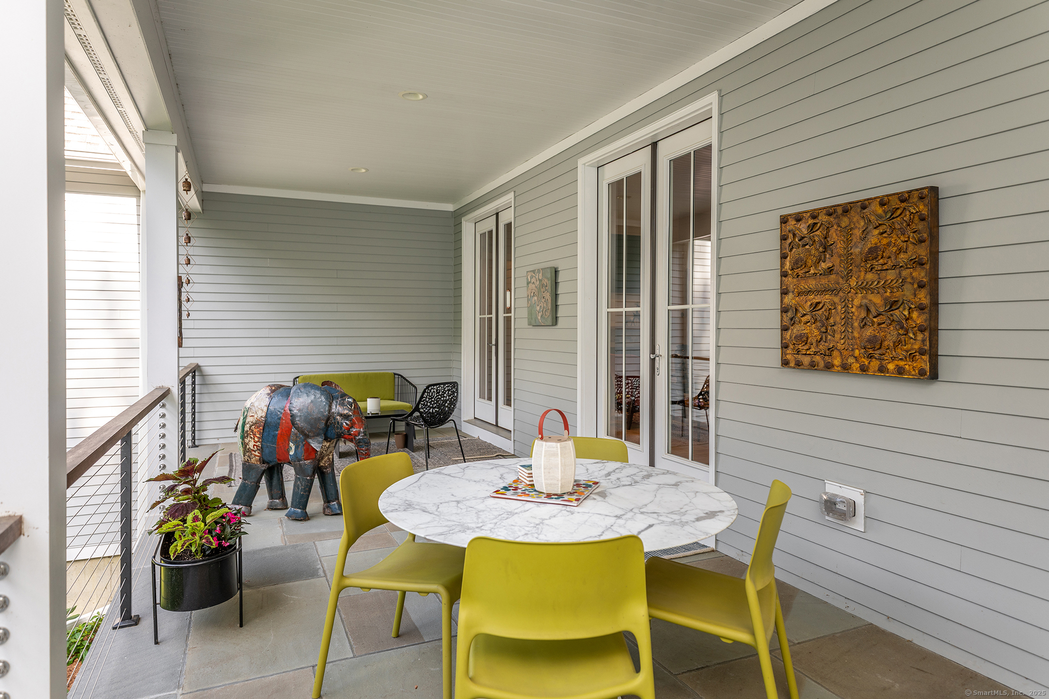 73 Long River Road Sherman, CT 06784 - Photo 13 of 31 a outdoor dining space with furniture and potted plants
