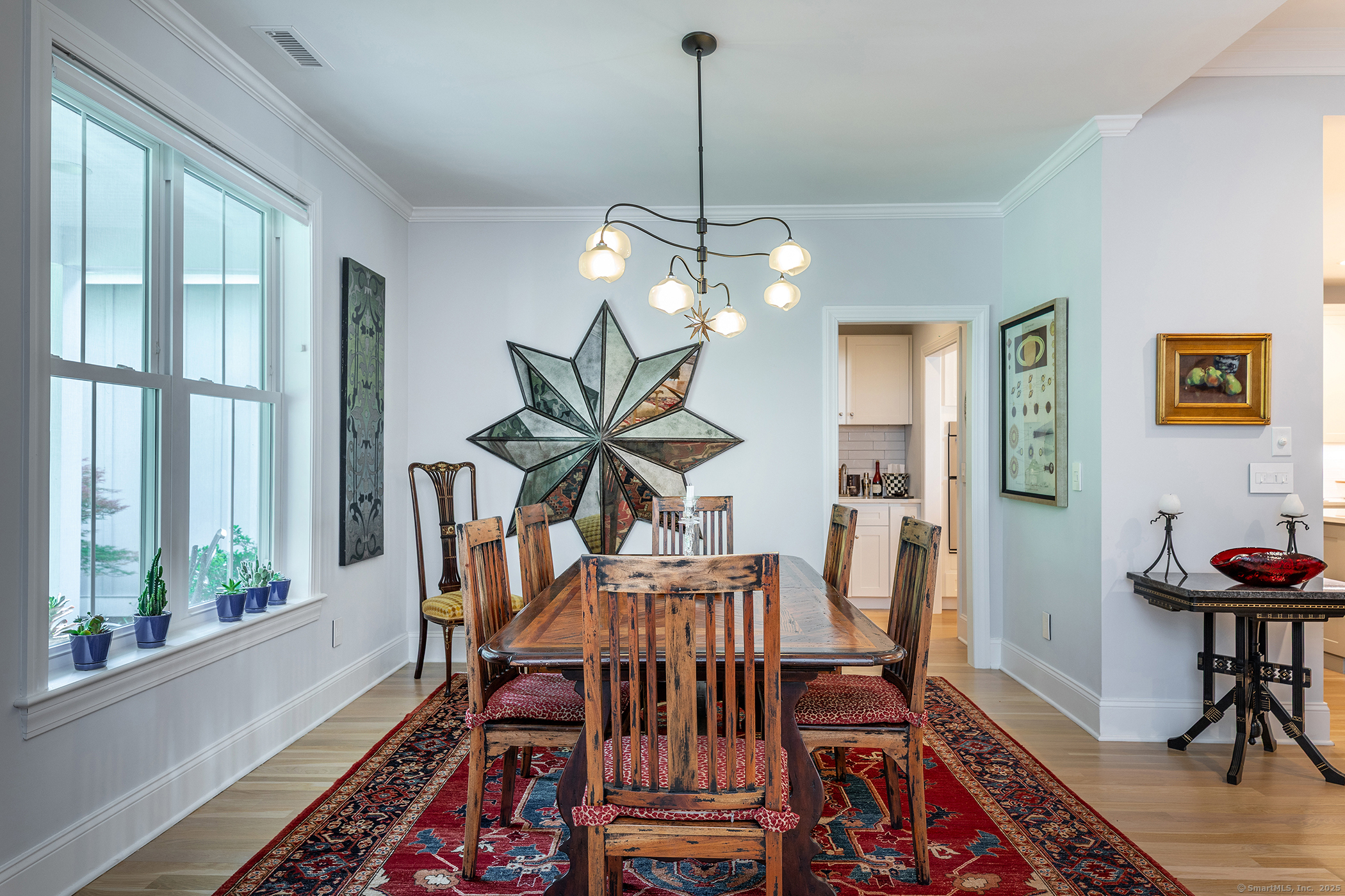 73 Long River Road Sherman, CT 06784 - Photo 17 of 31 a view of a dining room with furniture window and wooden floor