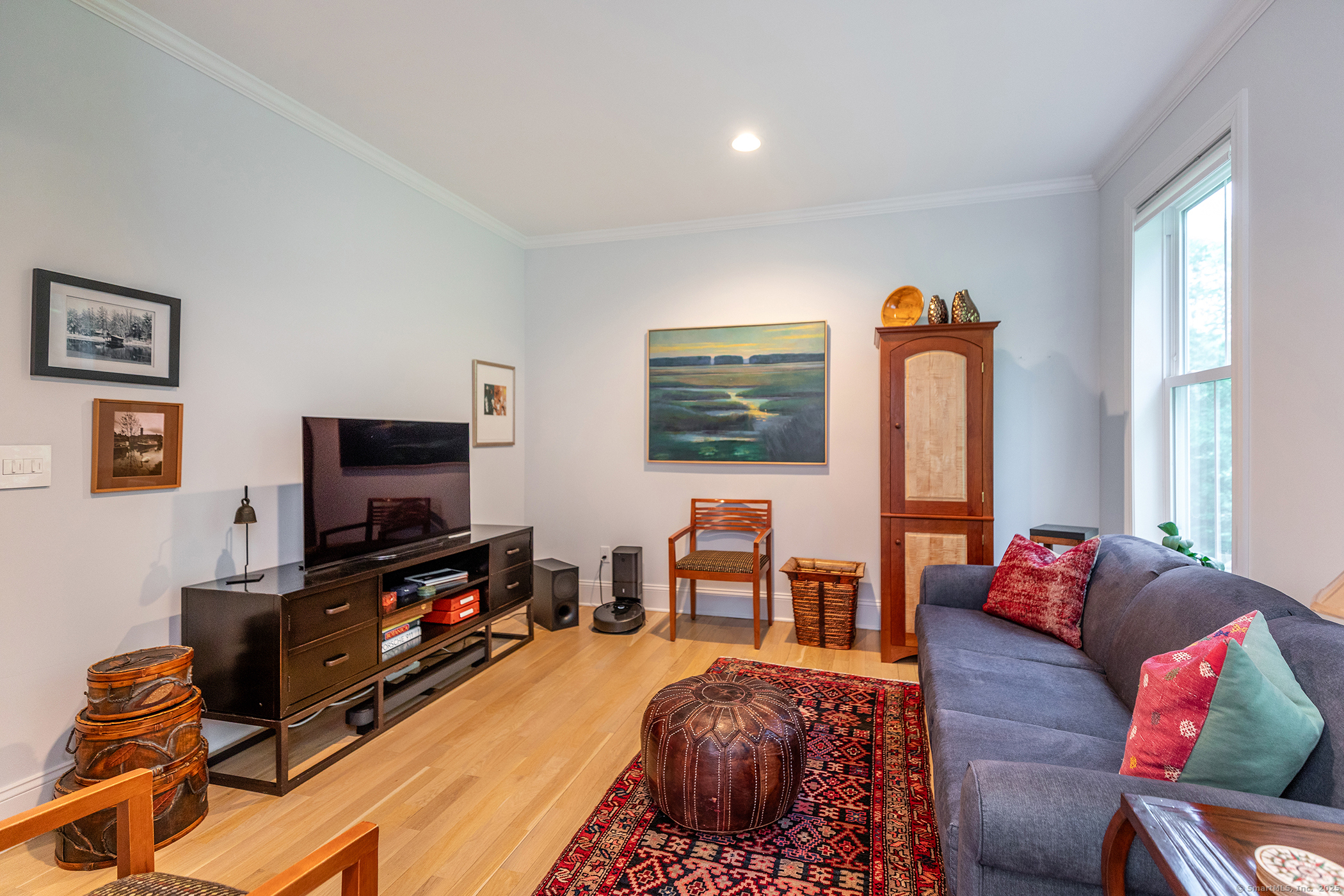 73 Long River Road Sherman, CT 06784 - Photo 18 of 31 a living room with furniture and a flat screen tv