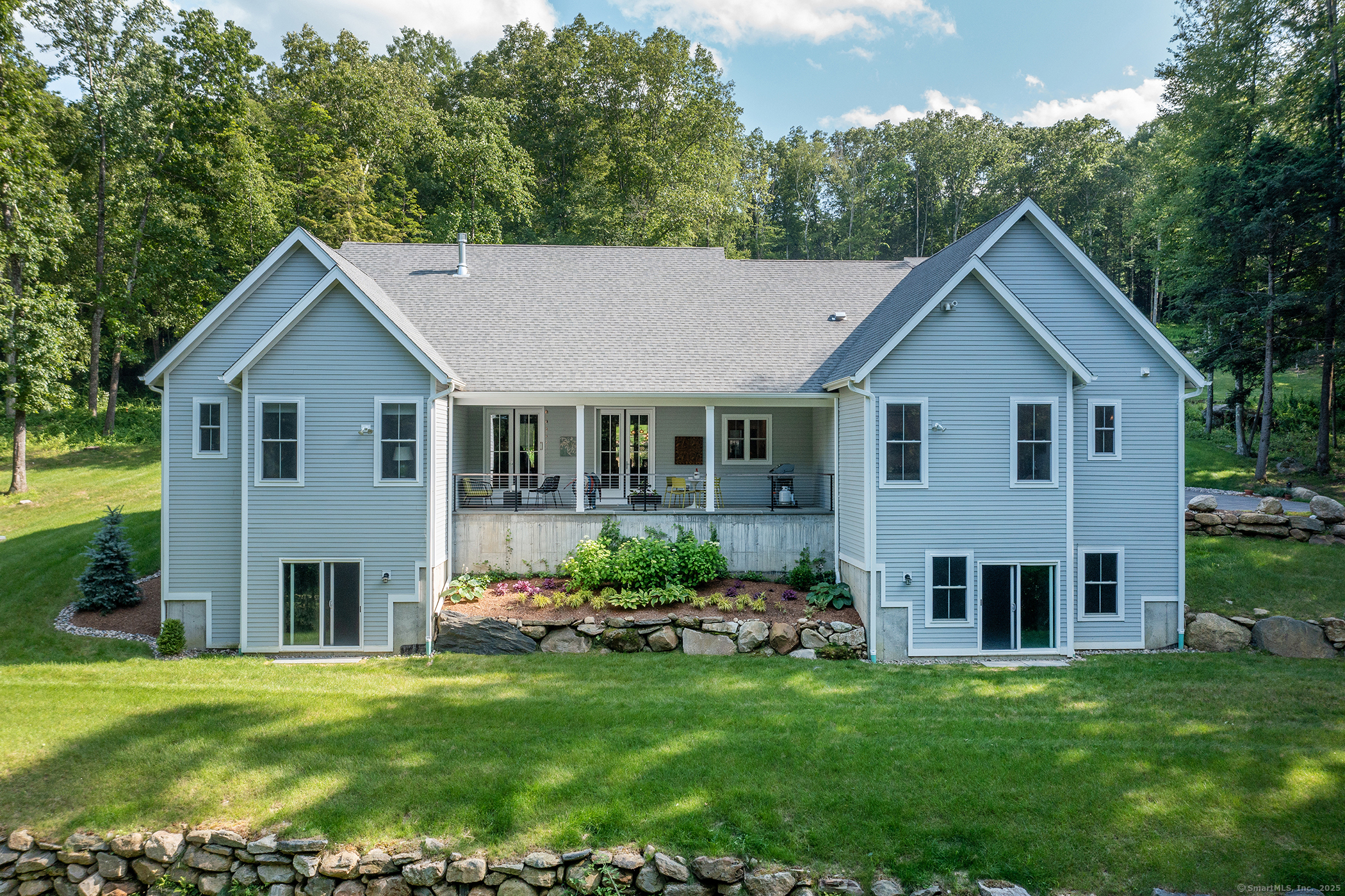 73 Long River Road Sherman, CT 06784 - Photo 28 of 31 a house view with a garden space