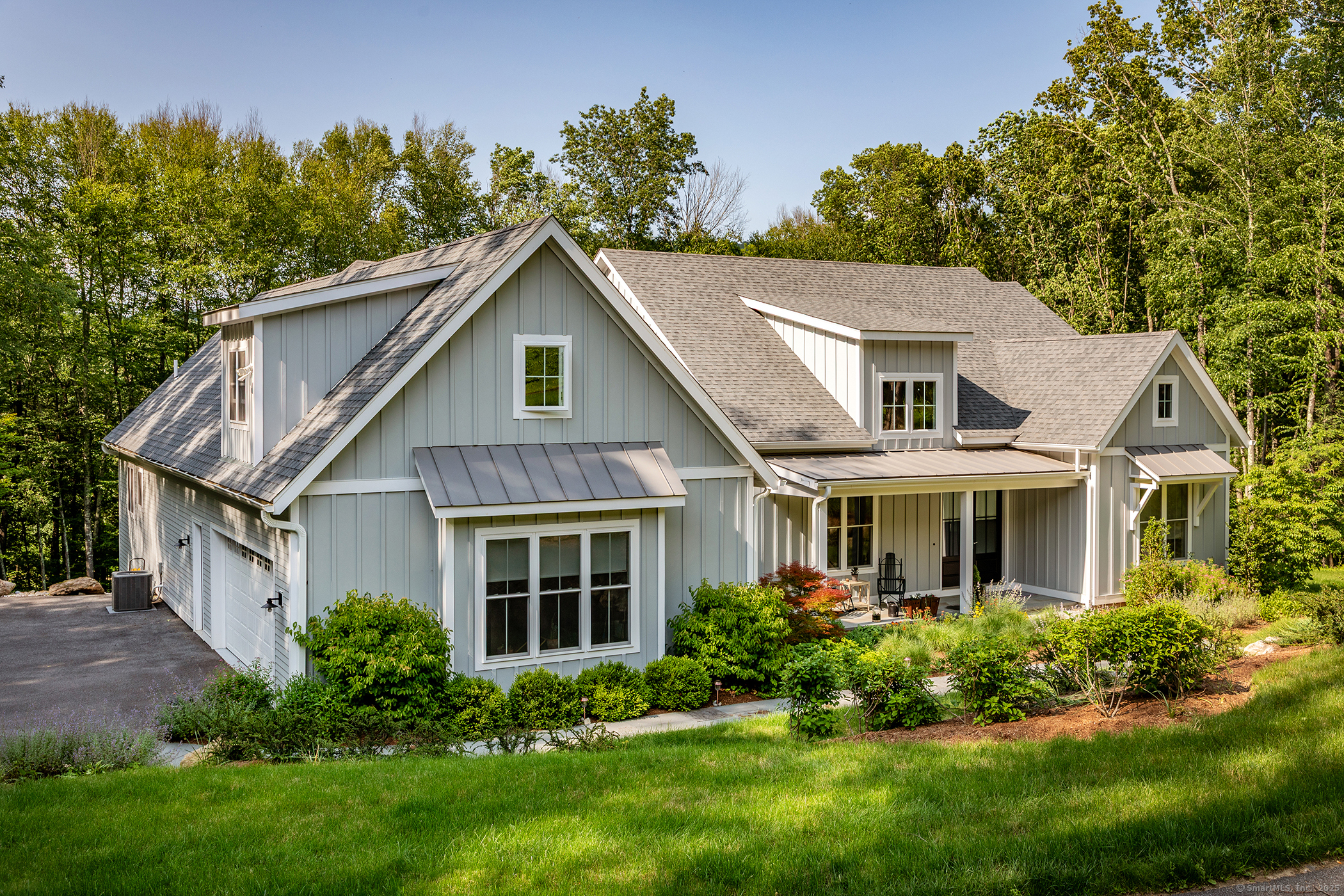 73 Long River Road Sherman, CT 06784 - Photo 29 of 31 a front view of a house with a yard