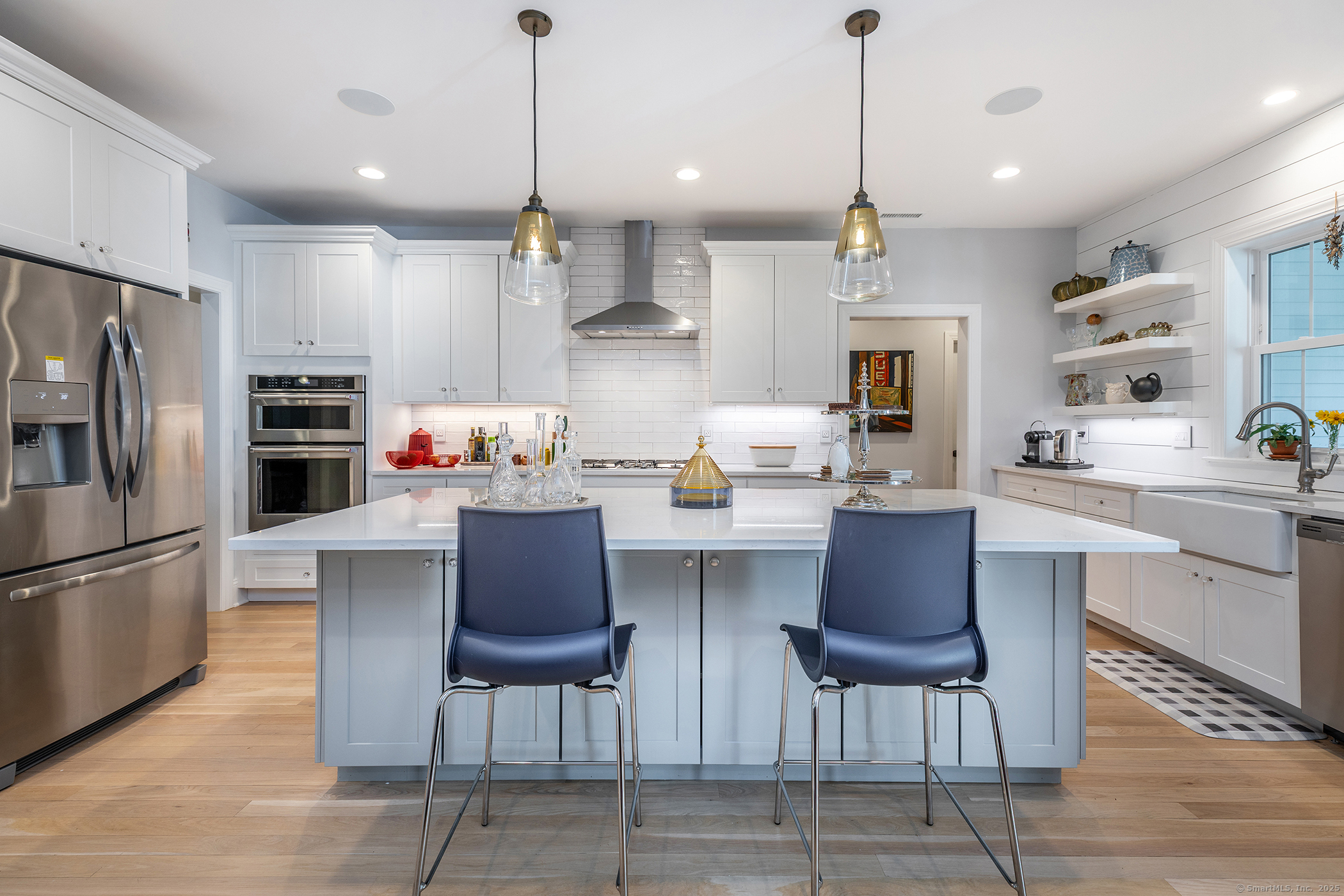 73 Long River Road Sherman, CT 06784 - Photo 6 of 31 a kitchen with stainless steel appliances granite countertop a stove a refrigerator a kitchen island a dining table and chairs