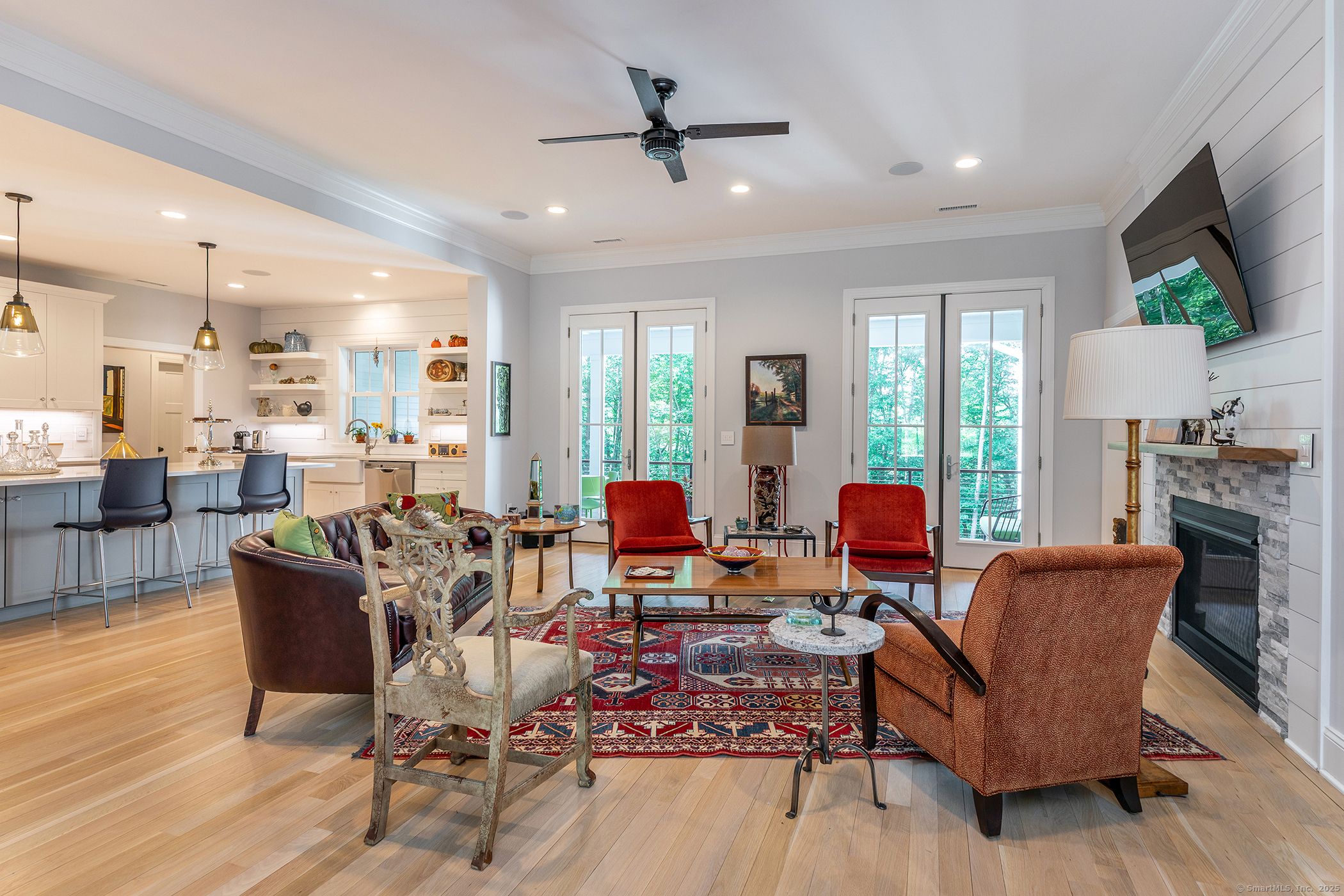 73 Long River Road Sherman, CT 06784 - Photo 10 of 31 a living room with fireplace furniture and a flat screen tv