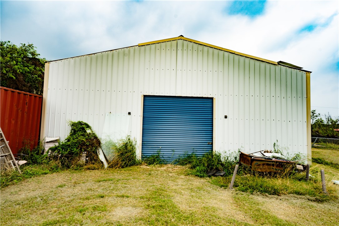 a backyard of a house with plants and trees