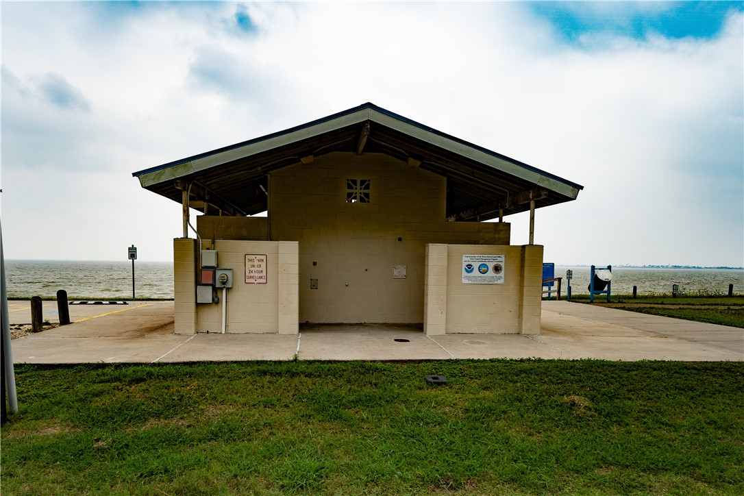 608 1st Street Bayside, TX 78340 - Photo 11 of 16 a front view of a house with garden
