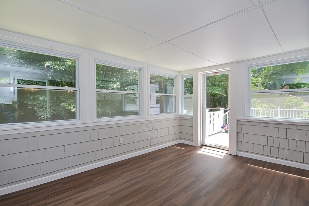 2 Labo Lane Bedford, MA 01730 - Photo 11 of 40 a view of empty room with wooden floor and fan