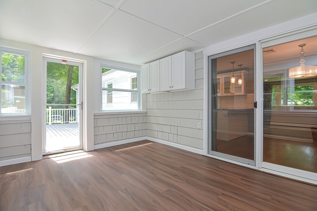 2 Labo Lane Bedford, MA 01730 - Photo 12 of 40 an empty room with wooden floor and windows