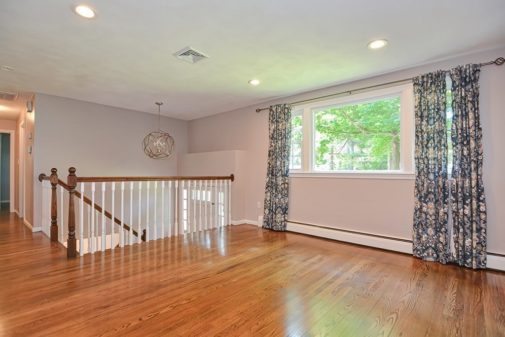 2 Labo Lane Bedford, MA 01730 - Photo 15 of 40 an empty room with wooden floor and windows
