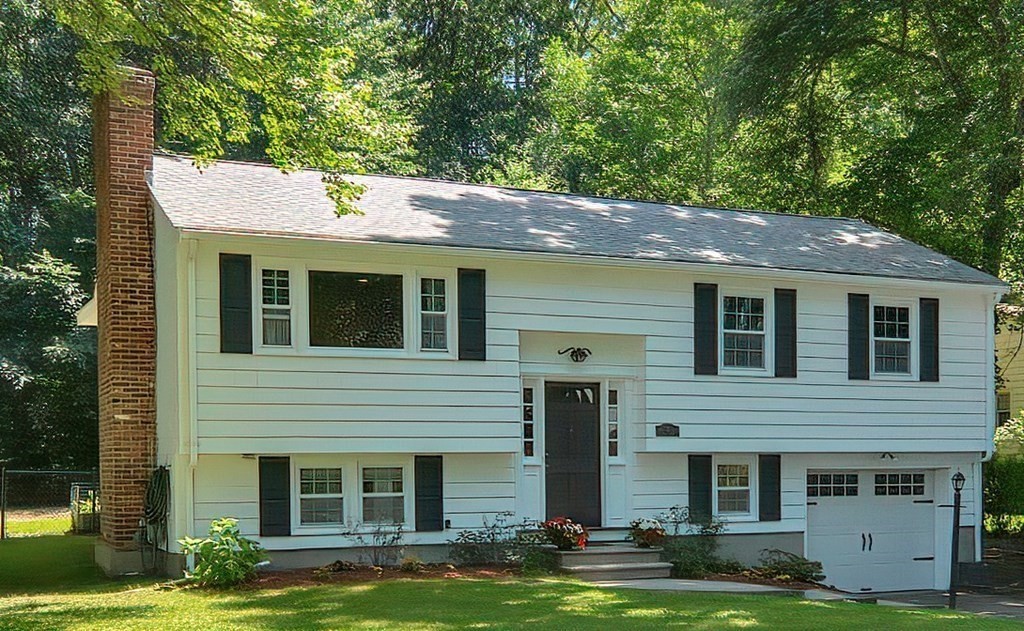 2 Labo Lane Bedford, MA 01730 - Photo 2 of 40 a front view of a house with yard and garage