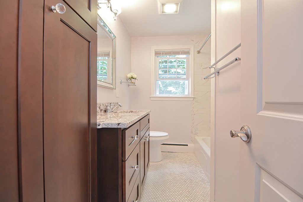 2 Labo Lane Bedford, MA 01730 - Photo 22 of 40 a bathroom with a sink a toilet and shower