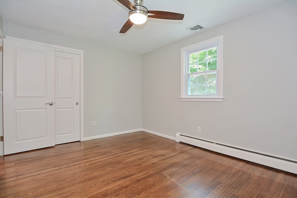 2 Labo Lane Bedford, MA 01730 - Photo 23 of 40 wooden floor in an empty room with a window