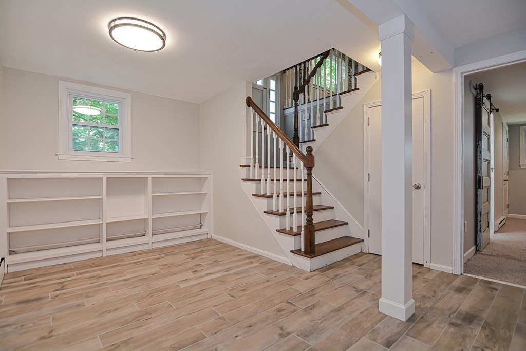 2 Labo Lane Bedford, MA 01730 - Photo 30 of 40 a view of entryway with wooden floor and stairs