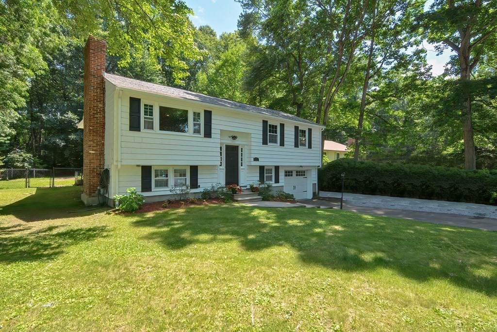 2 Labo Lane Bedford, MA 01730 - Photo 3 of 40 a view of a house with a yard patio and a swimming pool