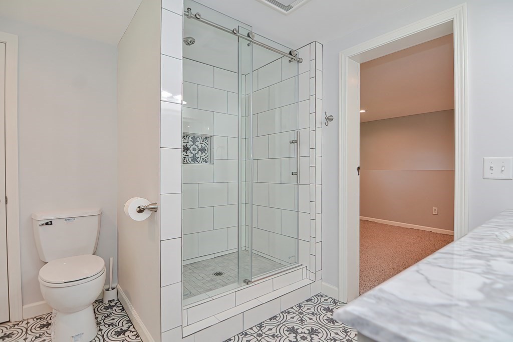 2 Labo Lane Bedford, MA 01730 - Photo 32 of 40 a bathroom with a shower and a toilet
